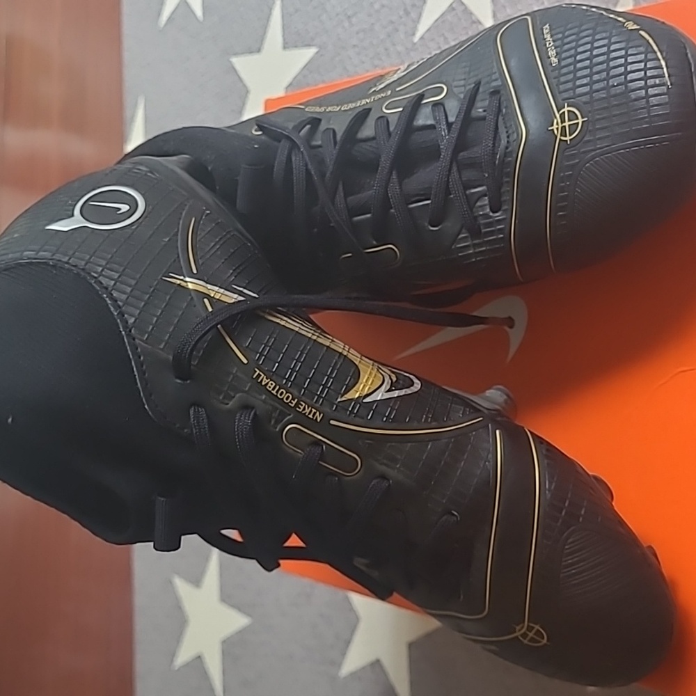 Nike Jr Superfly 8 Academy FG MG soccer cleats in black and gold